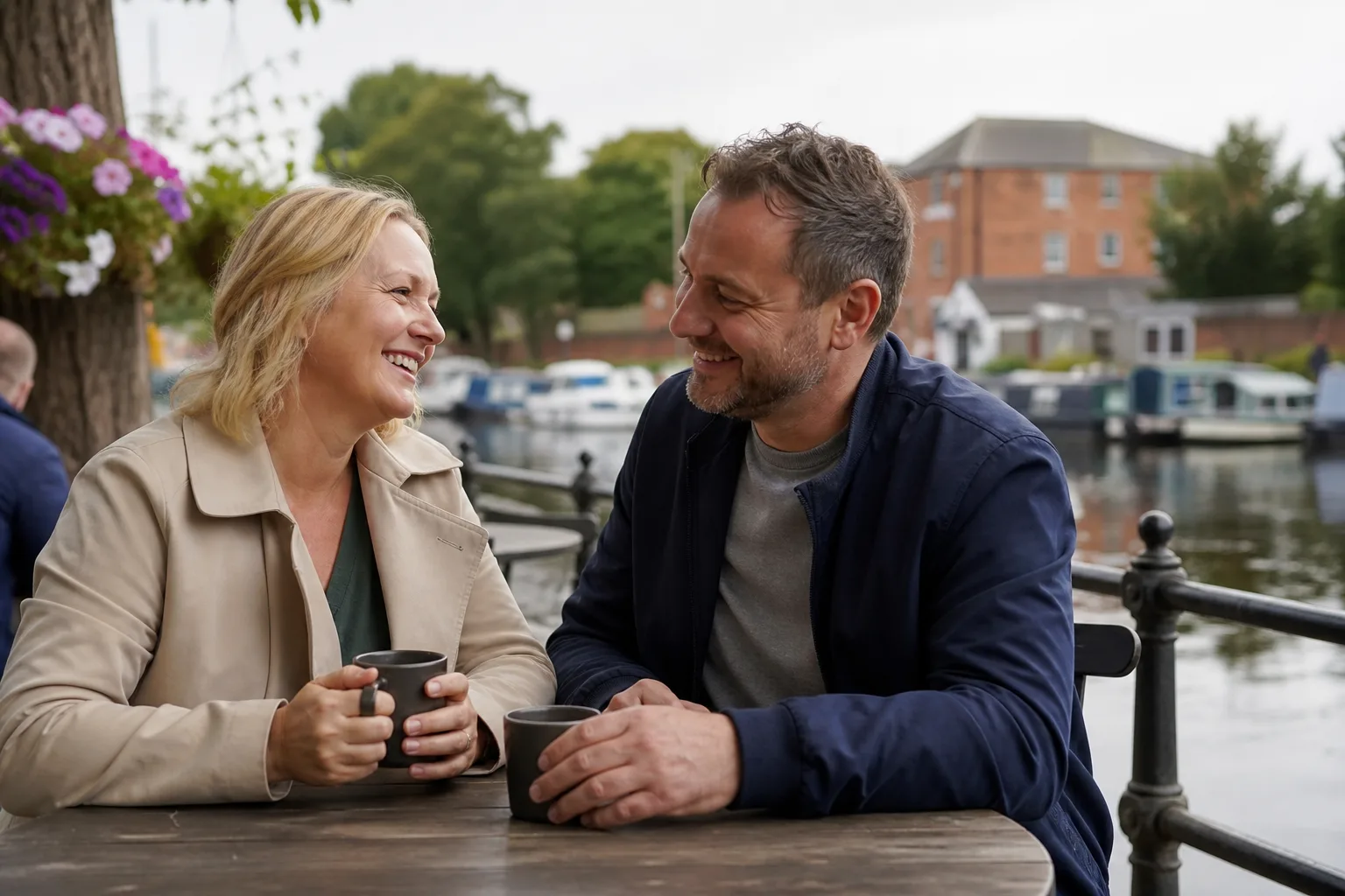 Two people walking beside the River Weaver in Northwich